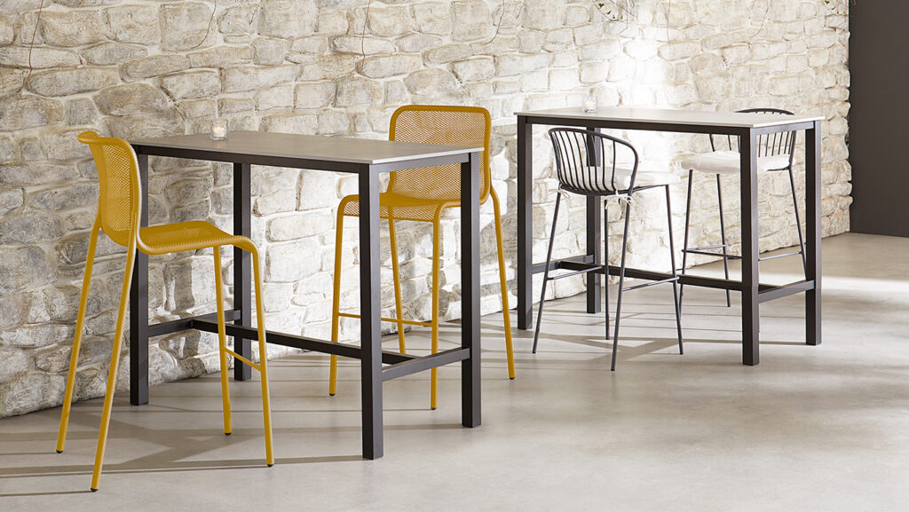 two blox table bases with a set of high top seats at each