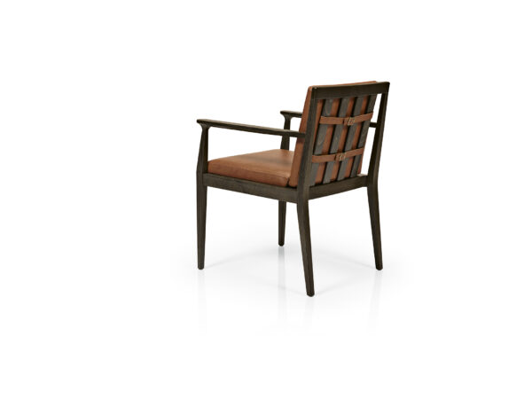 Chelsea Arm Chair back. Wood Frame with rust upholstered seat and back. Back has belt holding cushion to frame.