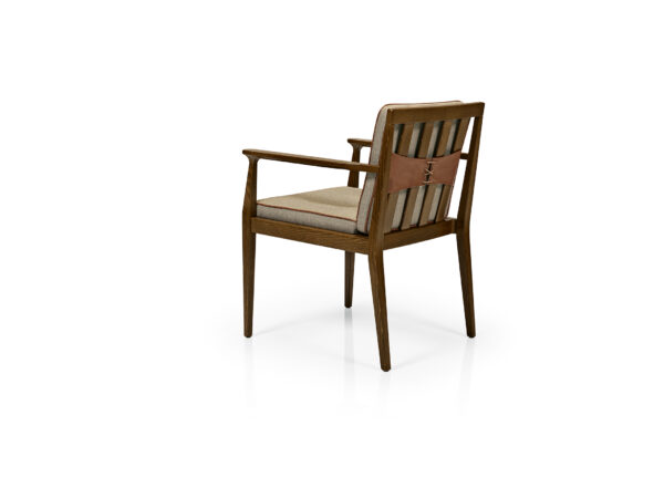 Chelsea Arm Chair back. Wood Frame with neutral upholstered seat and back with welt. Back has corset lace up holding cushion to frame.