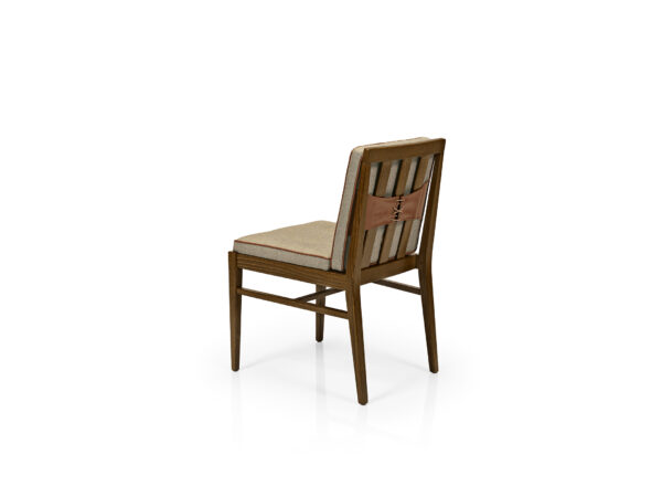 Chelsea Side Chair back. Wood Frame with neutral upholstered seat and back with welt. Back has corset lace up holding cushion to frame.